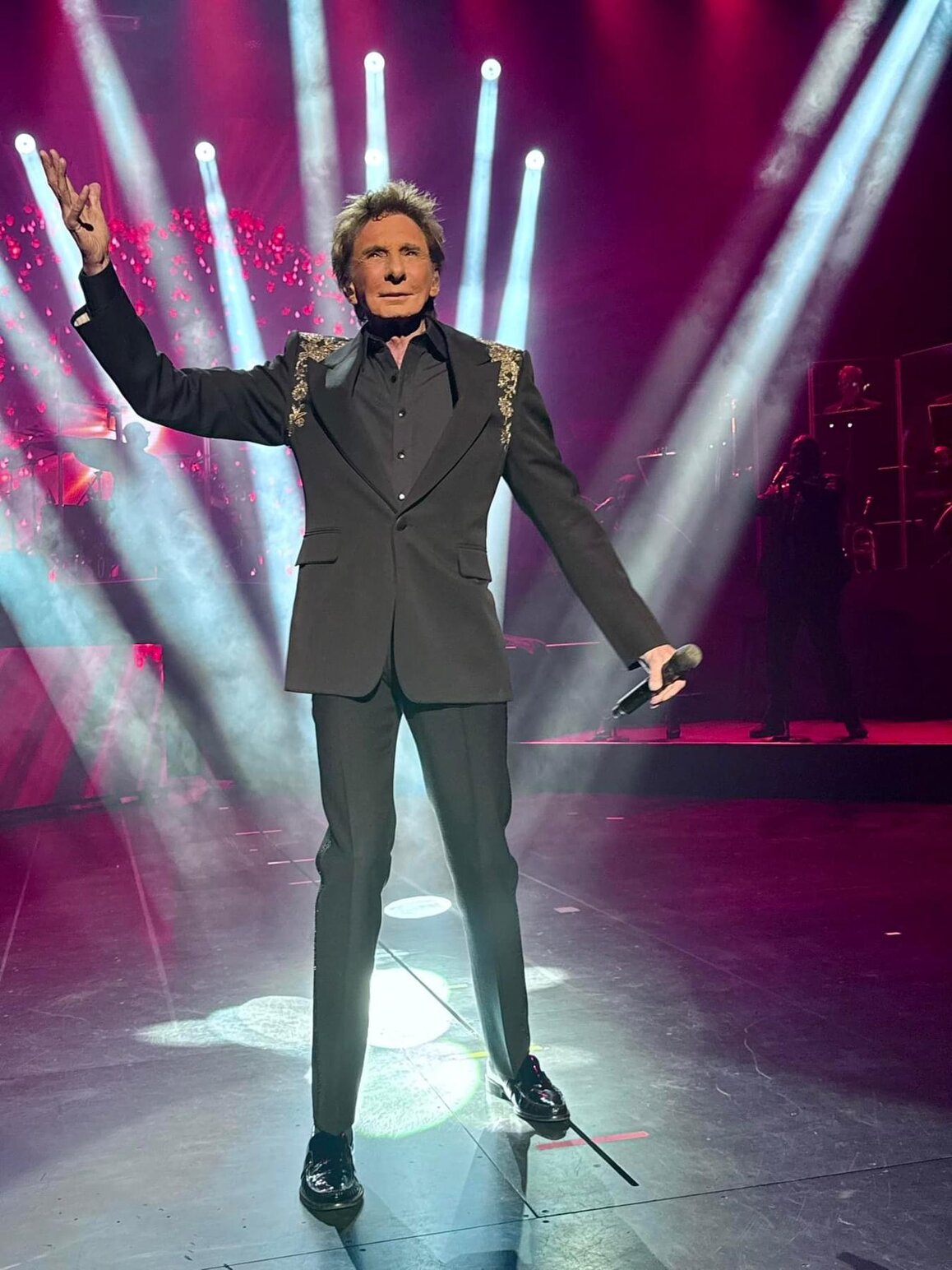 Barry Manilow performing on a Las Vegas stage